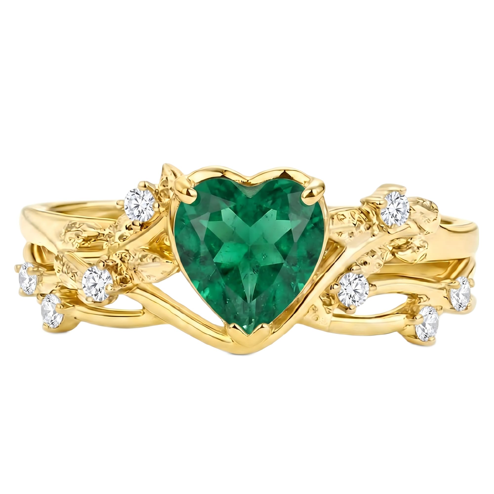 Yellow gold ring with a heart-cut emerald centerpiece and diamond accents on an ornate band.