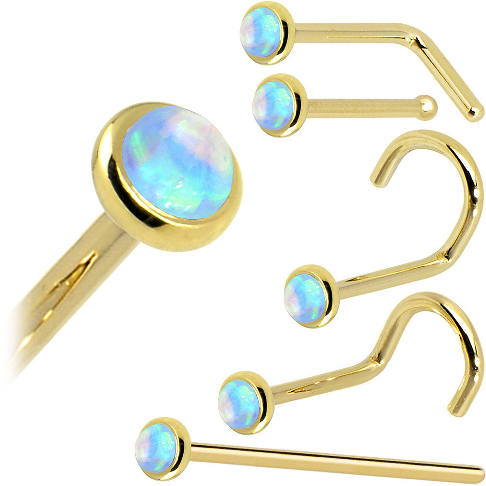 Set of gold nose rings with opal stones on a white background