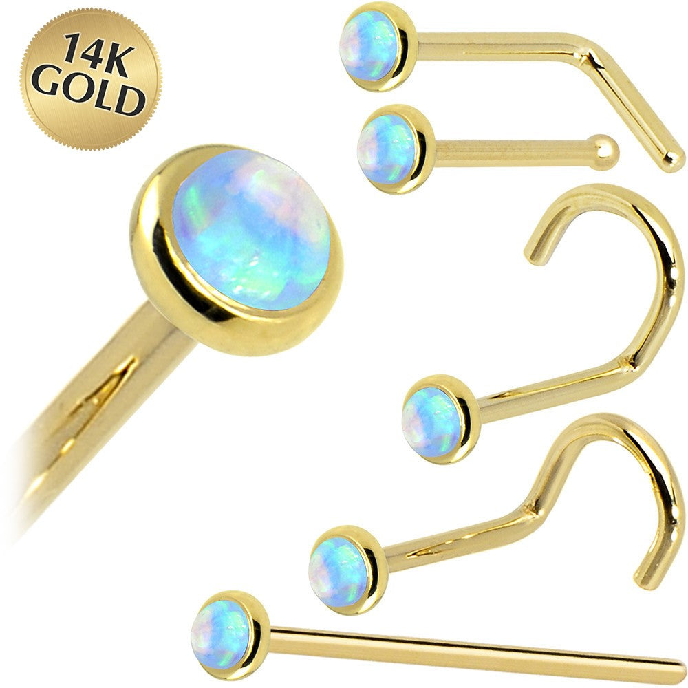 Gold nose rings with opal stones on a white background