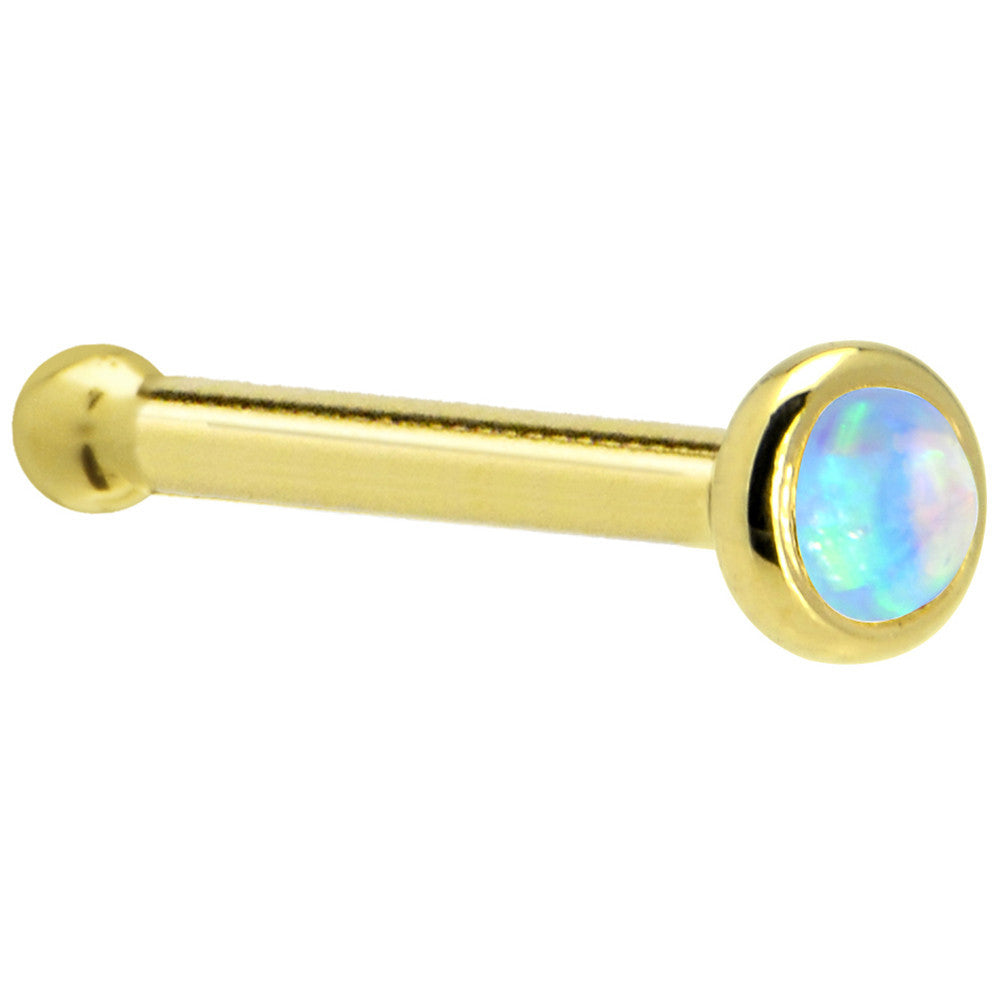 Gold barbell with a colorful gemstone on a white background
