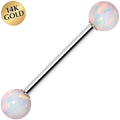 Gold-nosed ring with opal beads on a white background