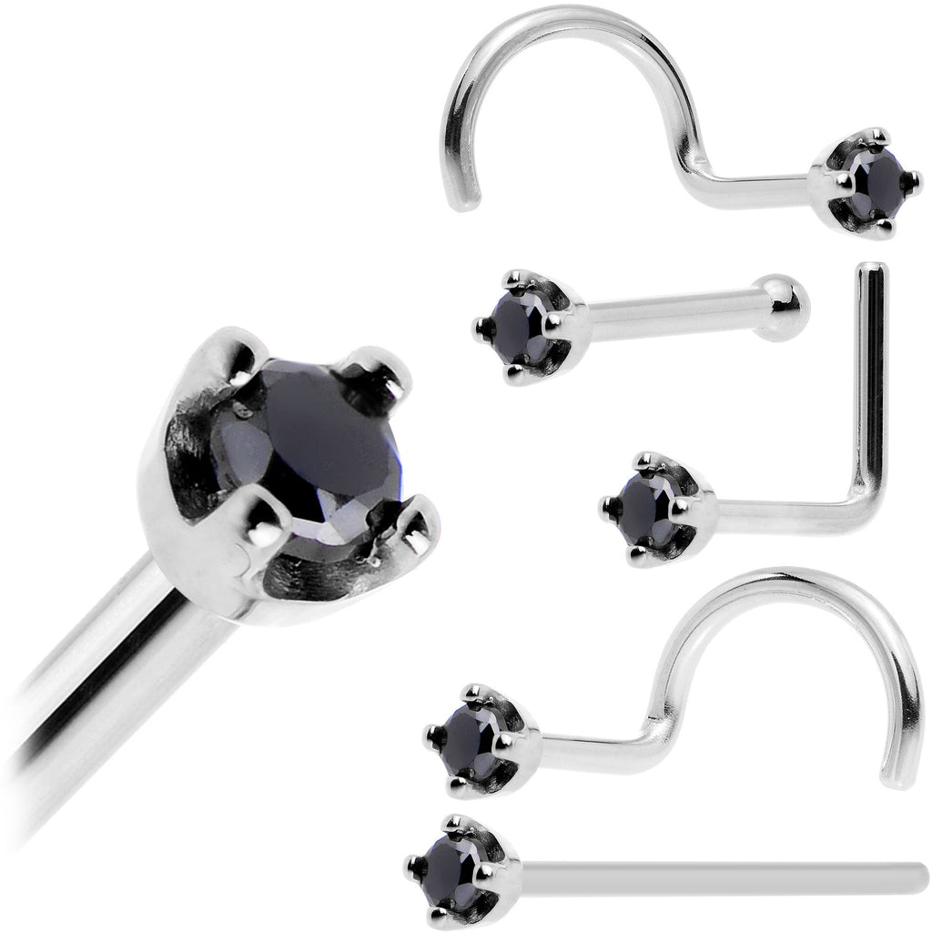Set of silver nose rings with black gemstones on a white background